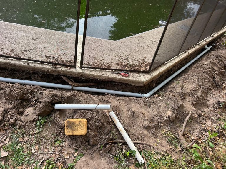 pool return line replacement with new pvc pipes installed around curved pool deck trench