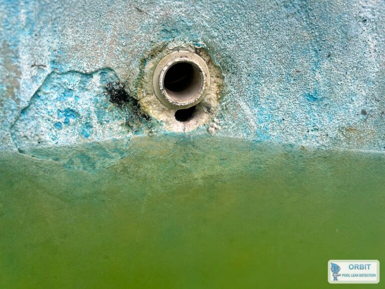 Cracked plaster around a pool return wall fitting on a concrete pool in Houston, TX